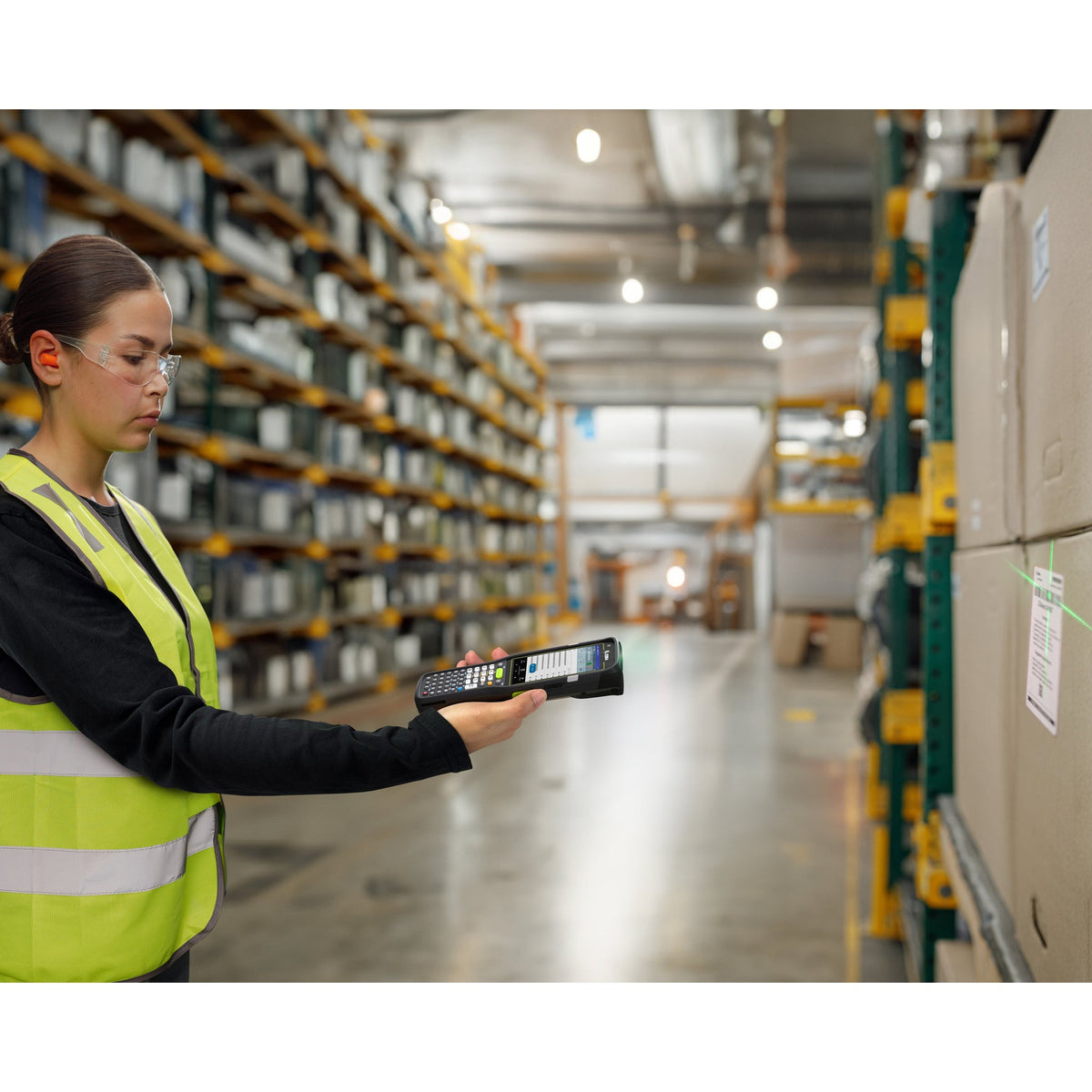 Zebra MC3400 rugged keypad mobile computer, straight shooter, 38-key function numeric keypad (MC3401-0S1P63SS-A6) – in use in a warehouse
